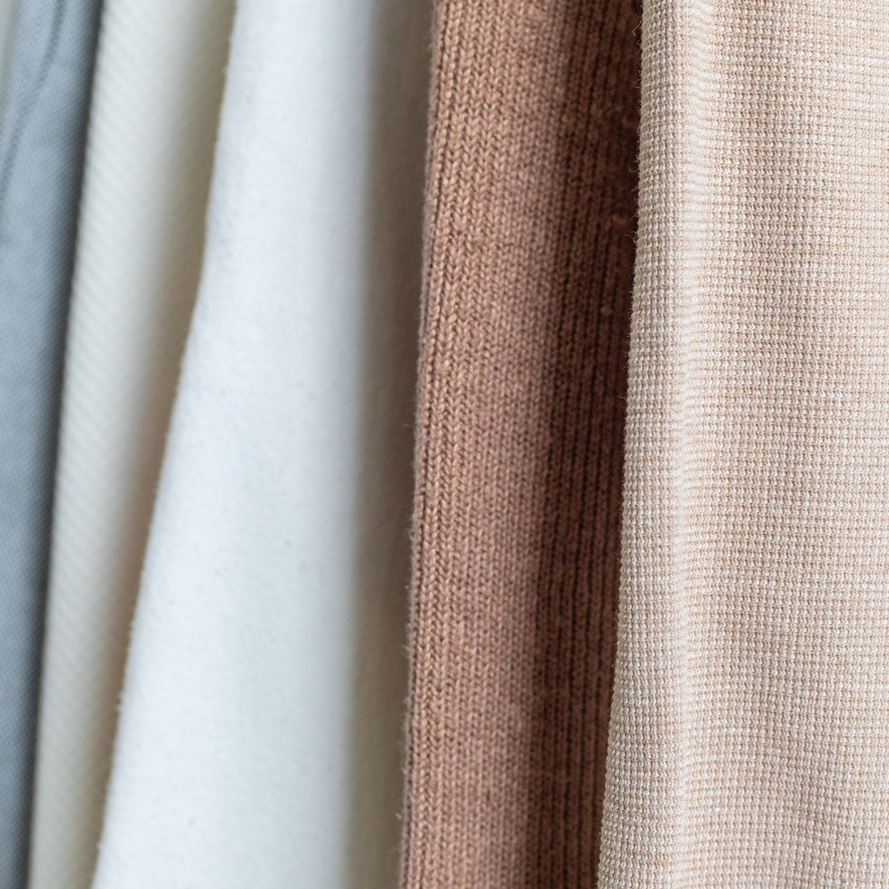 A close up of natural fiber clothing from slow fashion brand Daniela Salazar. Made of sustainable fabrics like organic cotton and hemp fabric.