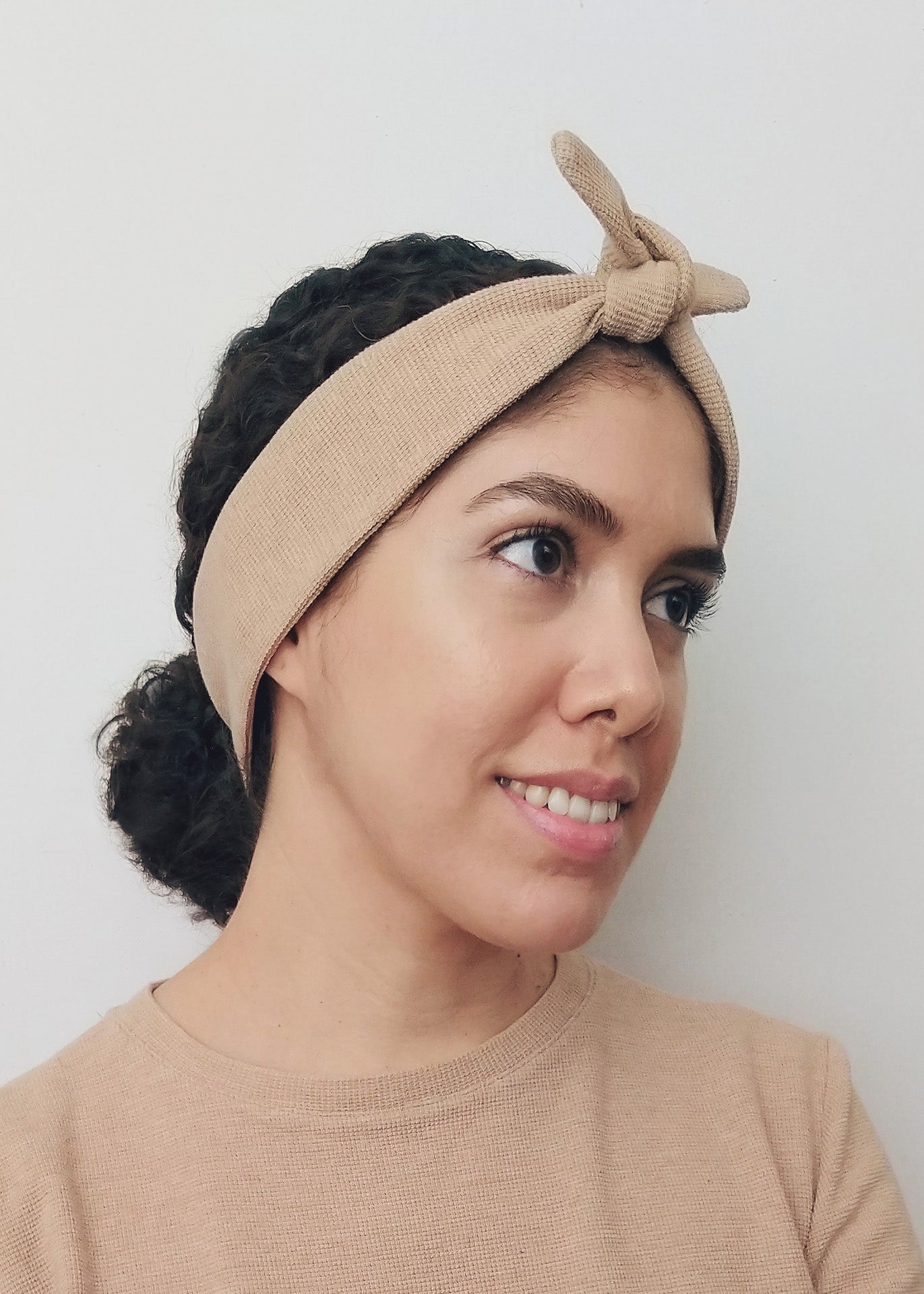 Woman wearing a brown organic cotton headband