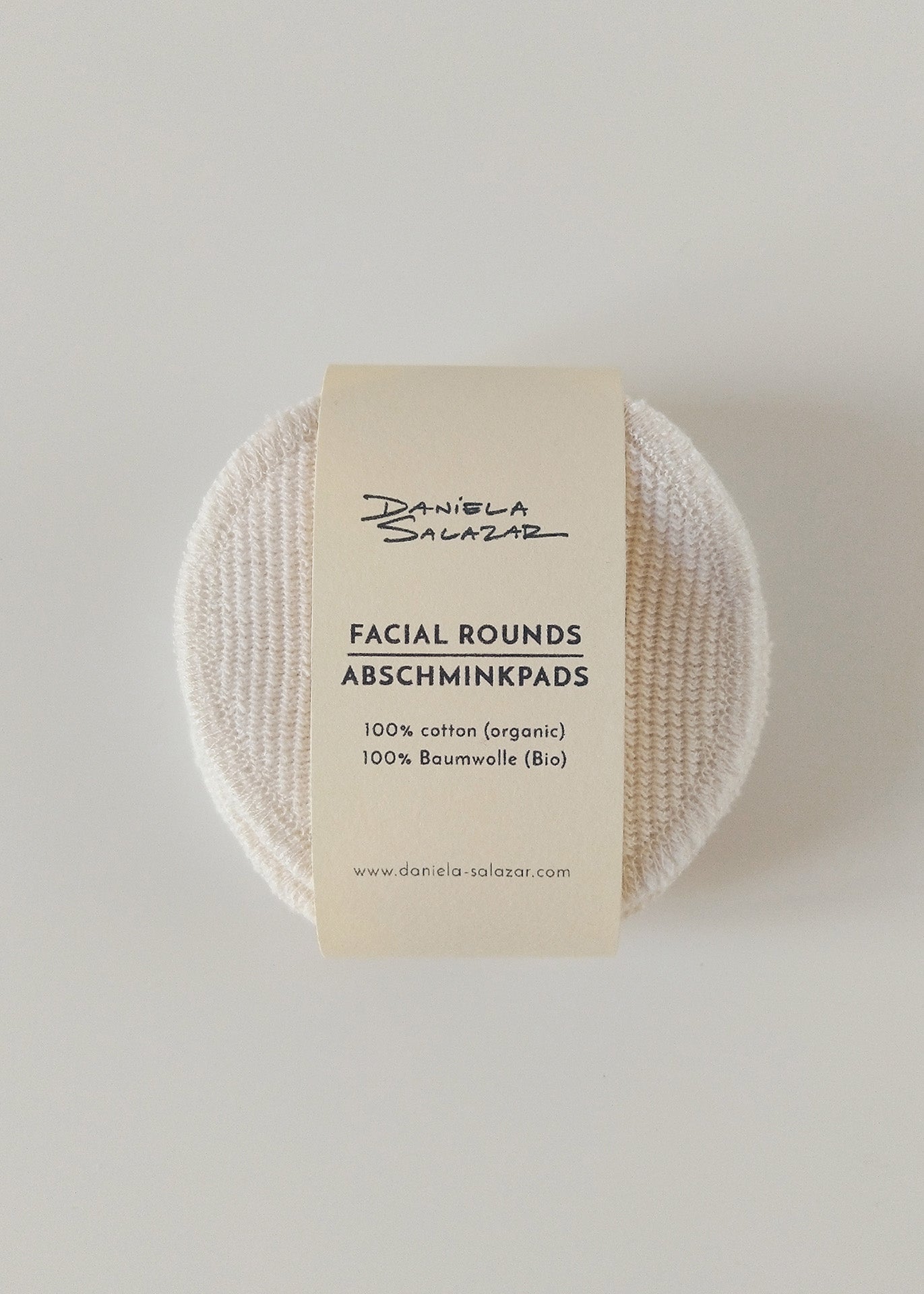 A pack of organic cotton face pads labeled 'Facial Rounds / Abschminkpads' with a textured side, displayed on a white background.