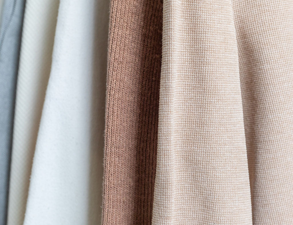 A close up of natural fiber clothing from slow fashion brand Daniela Salazar. Made of sustainable fabrics like organic cotton and hemp fabric.